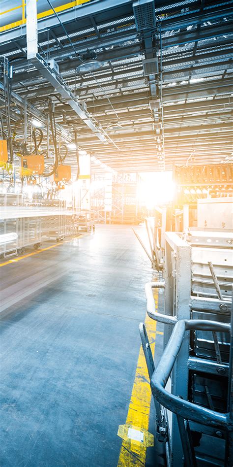 Vizuálna reprezentácia moderných výrobných liniek a kontrolných laboratórií v továrni.