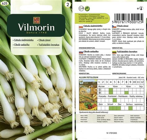 Detail struku so semenami vlčieho bôbu, s upozornením na toxicitu