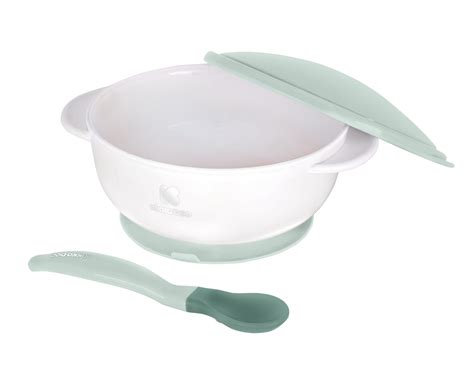 Ilustrácia dojčaťa s lyžičkou pri prvom príkrme